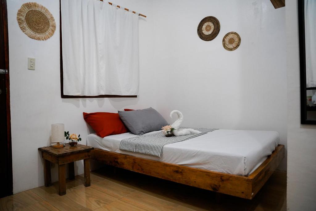 Postel nebo postele na pokoji v ubytování TOBY HOUSE SiARGAO