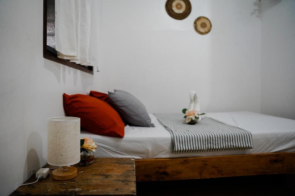 Postel nebo postele na pokoji v ubytování TOBY HOUSE SiARGAO