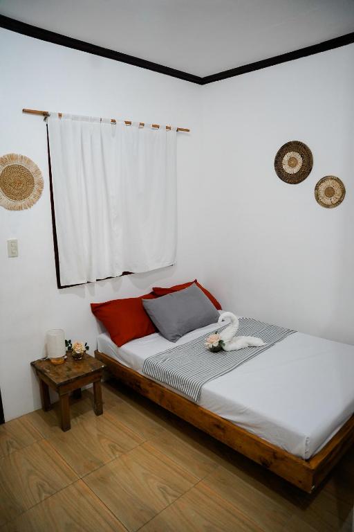 Postel nebo postele na pokoji v ubytování TOBY HOUSE SiARGAO