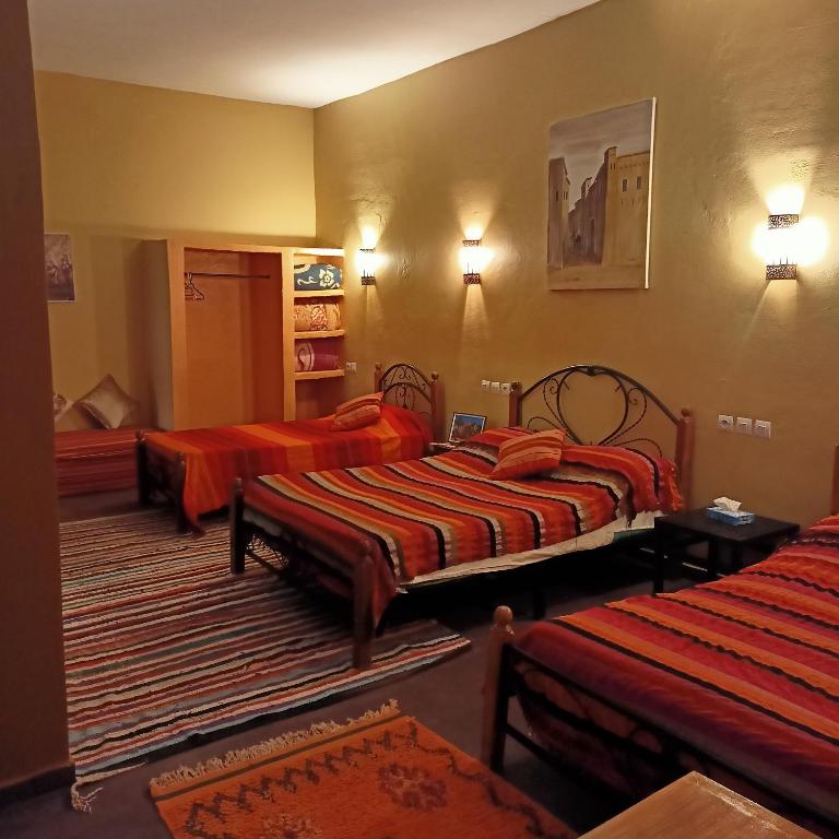 Postel nebo postele na pokoji v ubytování LESCALE DE OUARZAZATE