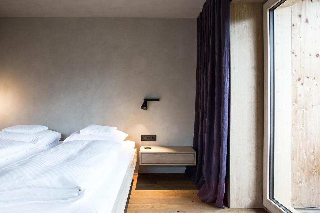 Postel nebo postele na pokoji v ubytování Biohotel Schwanen