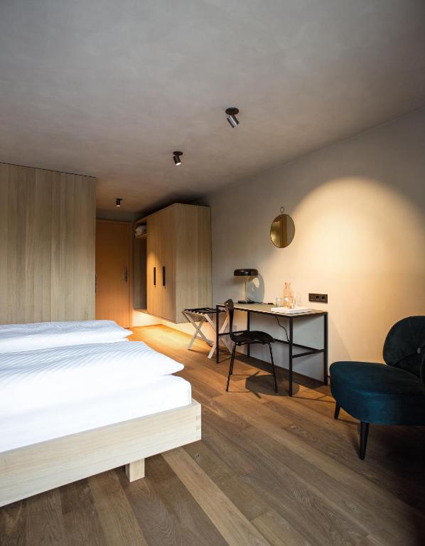 Postel nebo postele na pokoji v ubytování Biohotel Schwanen