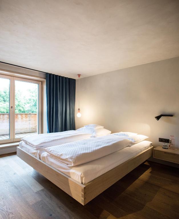 Postel nebo postele na pokoji v ubytování Biohotel Schwanen