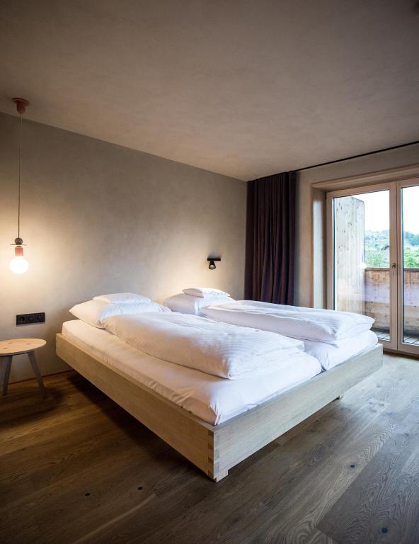 Postel nebo postele na pokoji v ubytování Biohotel Schwanen