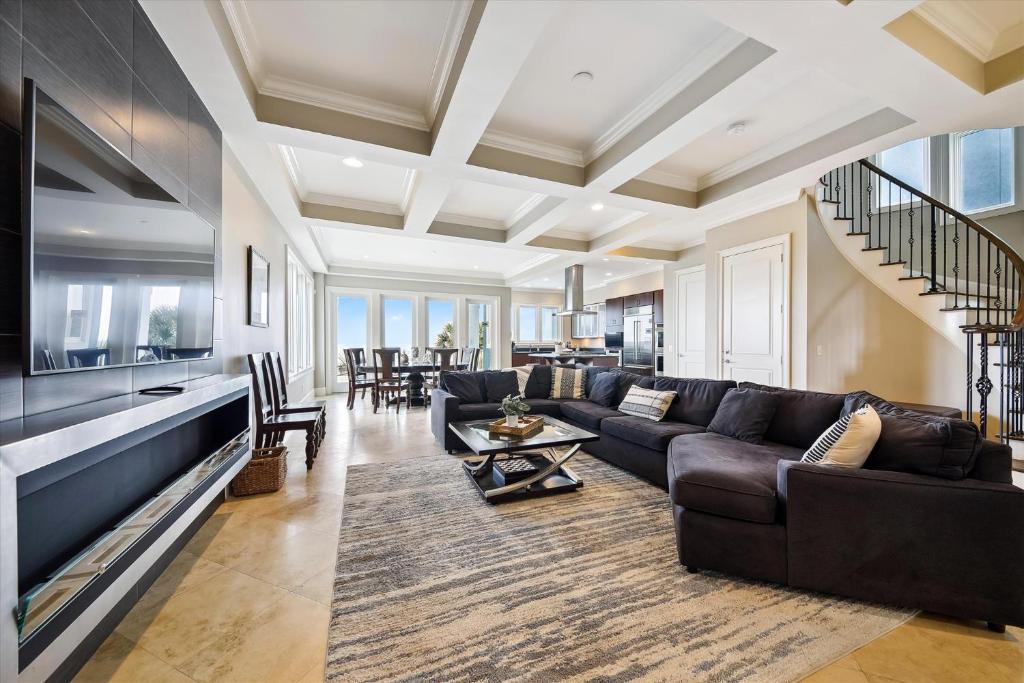 a living room with a couch and a table at 27 Singleton Beach- Oceanfront, Private Pool, Pool Table, FREE Activities Included in Hilton Head Island