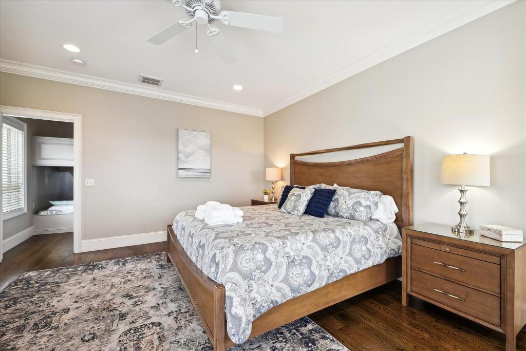 a bedroom with a large bed and a nightstand at 27 Singleton Beach- Oceanfront, Private Pool, Pool Table, FREE Activities Included in Hilton Head Island