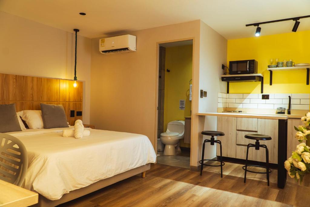 Una cama o camas en una habitación de Casa Origo Hospedaje