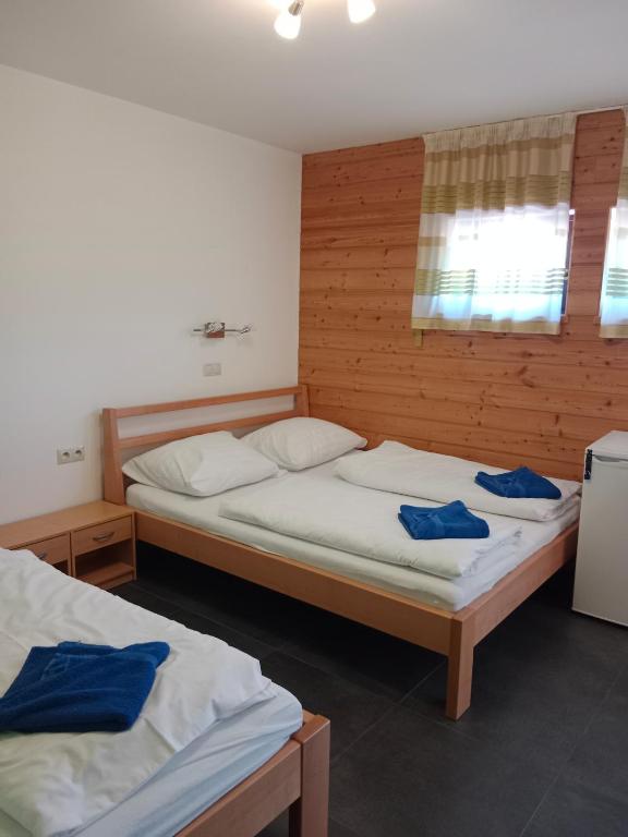 Postel nebo postele na pokoji v ubytování Penzion TOPAS