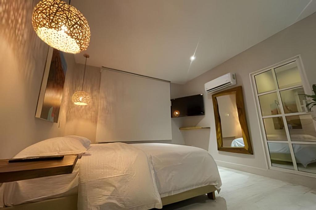 Postel nebo postele na pokoji v ubytování Marmulata Lofts