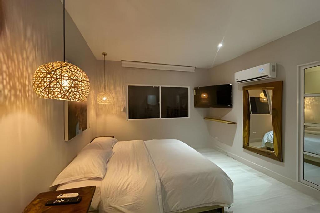 Postel nebo postele na pokoji v ubytování Marmulata Lofts