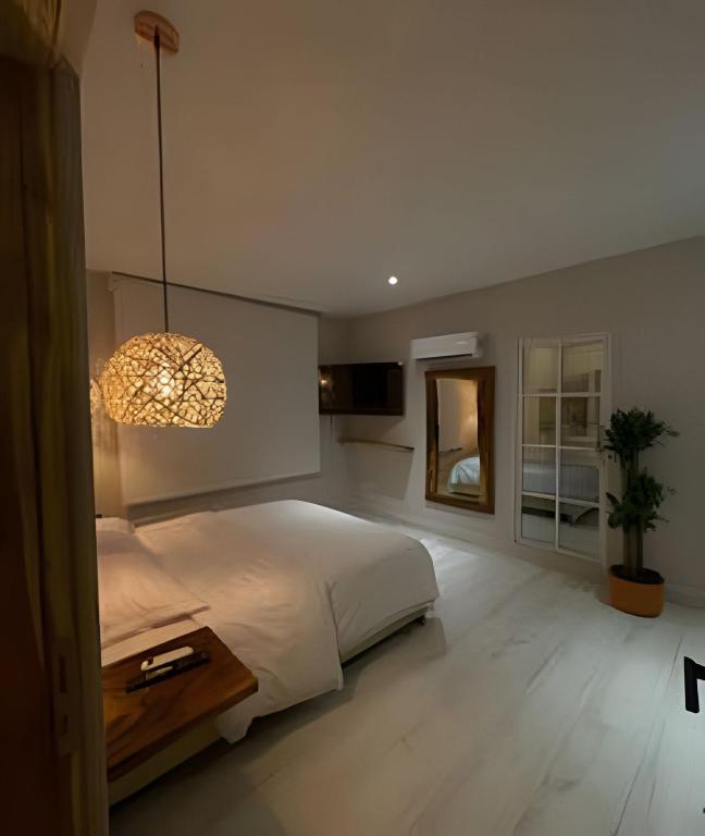 Postel nebo postele na pokoji v ubytování Marmulata Lofts