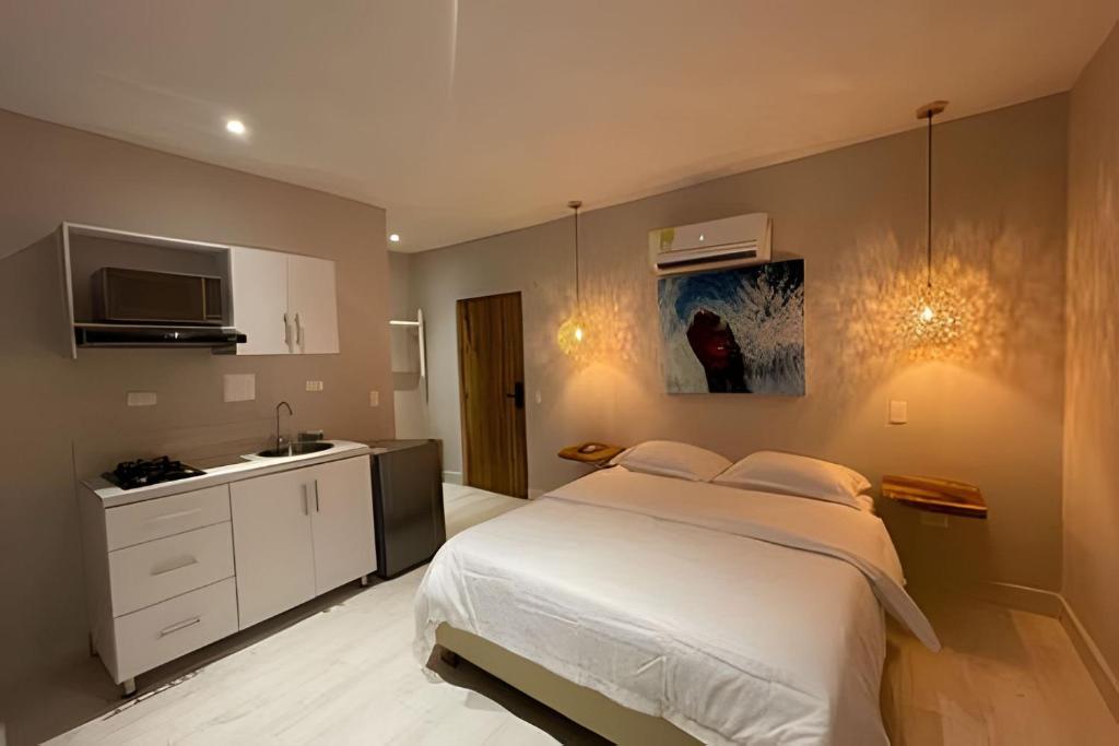 Postel nebo postele na pokoji v ubytování Marmulata Lofts