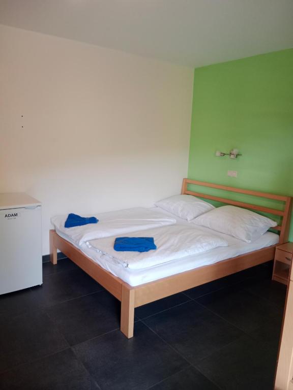 Postel nebo postele na pokoji v ubytování Penzion TOPAS