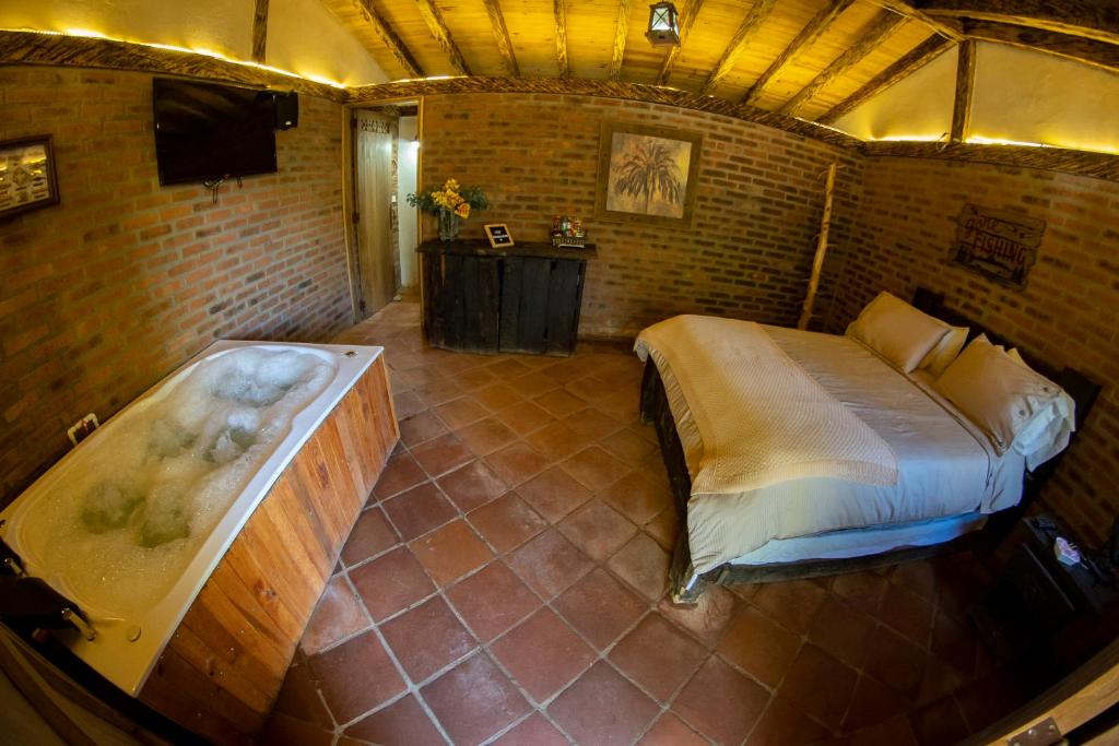 Postel nebo postele na pokoji v ubytování Refugio Natural Guarne