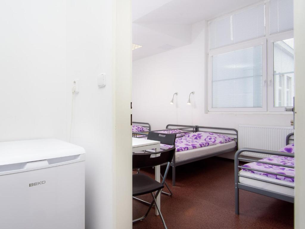 Postel nebo postele na pokoji v ubytování Hostel BOHEMIA
