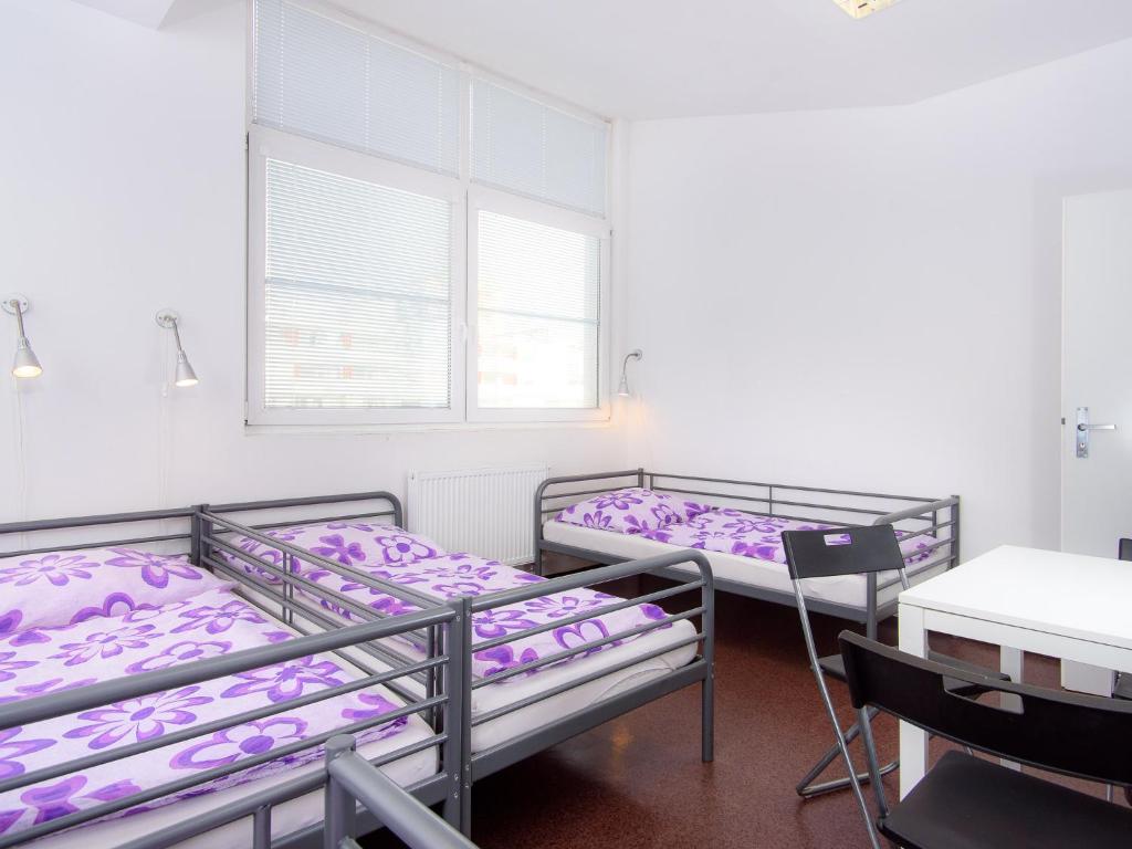 Postel nebo postele na pokoji v ubytování Hostel BOHEMIA