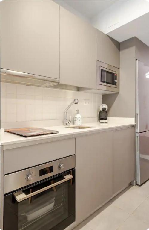 Kuchyňa alebo kuchynka v ubytovaní Nuevo loft céntrico parking gratuito