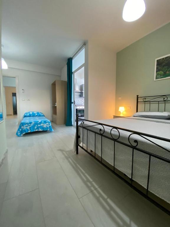 Postel nebo postele na pokoji v ubytování Leverblu House