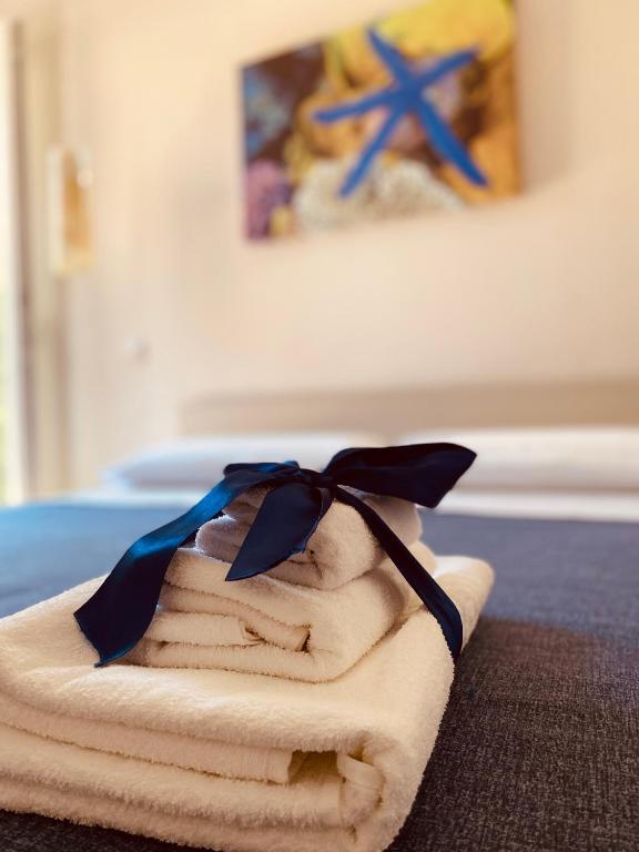 Postel nebo postele na pokoji v ubytování B&B degli Aranci