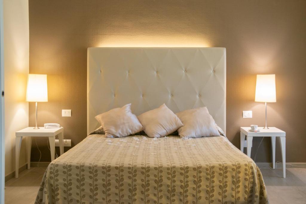Postel nebo postele na pokoji v ubytování Hotel Degli Ulivi