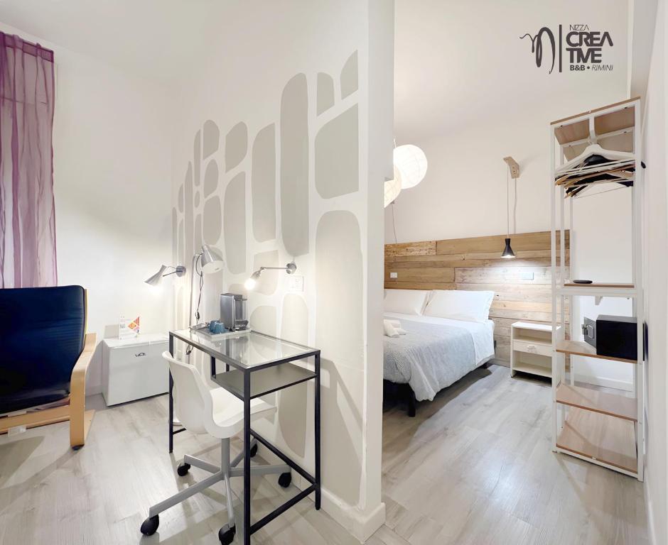 Giường trong phòng chung tại Hotel Nizza Creative Hotel