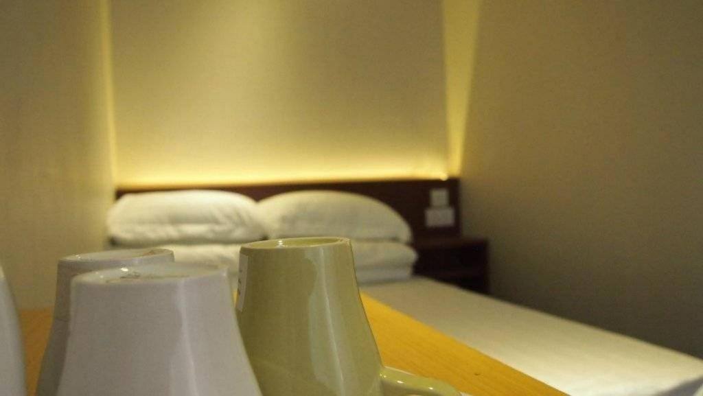 Voodi või voodid majutusasutuse 香港金門賓館 KamMun Guest House toas