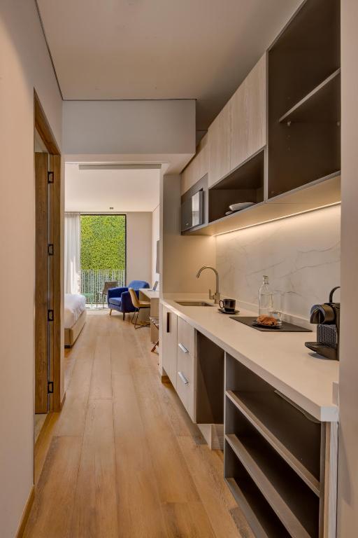 Kuchyň nebo kuchyňský kout v ubytování Vuestro Hotel Boutique