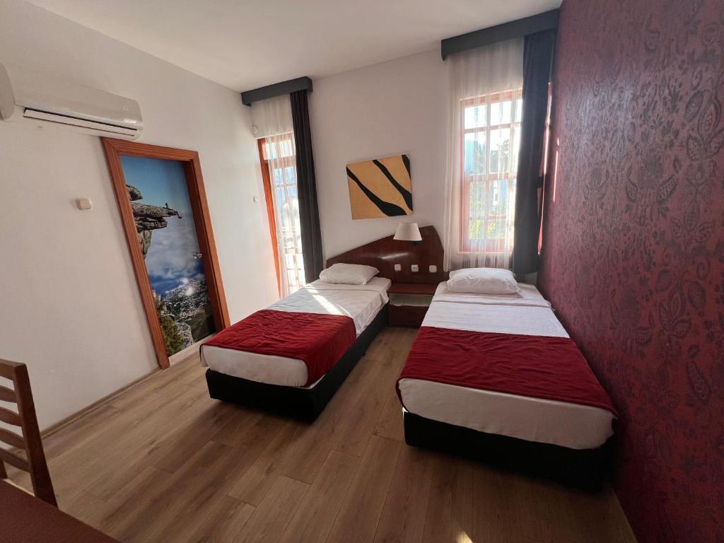 Postel nebo postele na pokoji v ubytování Şima Hotel Kemer