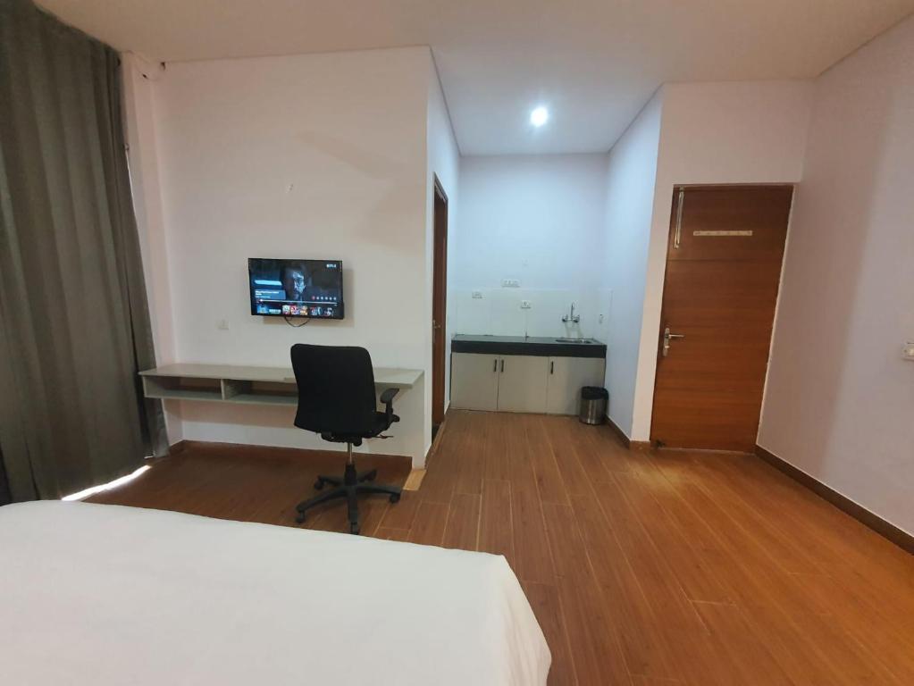 TV a/nebo společenská místnost v ubytování Mallenzo Suites Dlf Phase 1