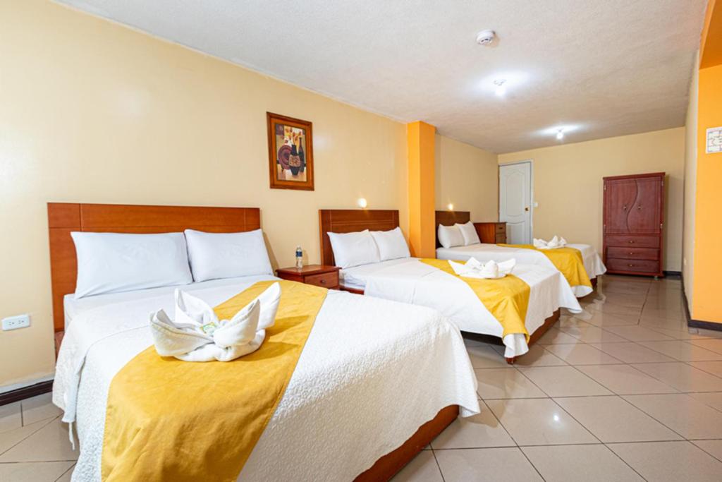 Postel nebo postele na pokoji v ubytování Hotel Miraflores