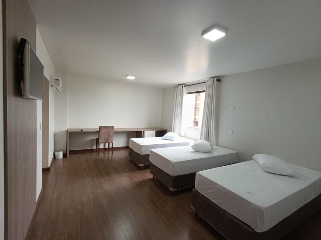 Postel nebo postele na pokoji v ubytování Arca's Hotel Umuarama