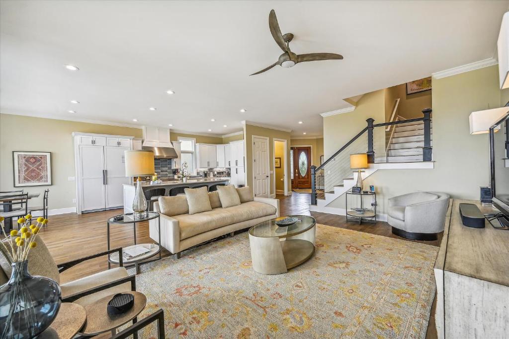 a living room with a couch and a table at 4 Collier Beach Rd- Oceanfront, Private Pool, Elevator, FREE Activities Included in Hilton Head Island