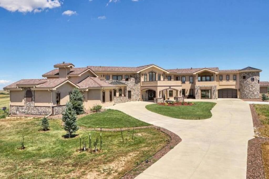 a large house with a driveway at Luxury Mansion Retreat Sleeps 20 Panoramic VIEWS in Castle Rock