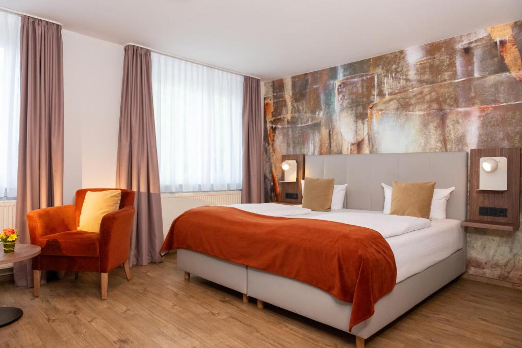 Postel nebo postele na pokoji v ubytování Art Hotel Aachen