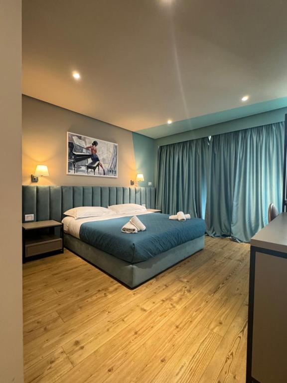 Postel nebo postele na pokoji v ubytování Festim Villa Hotel
