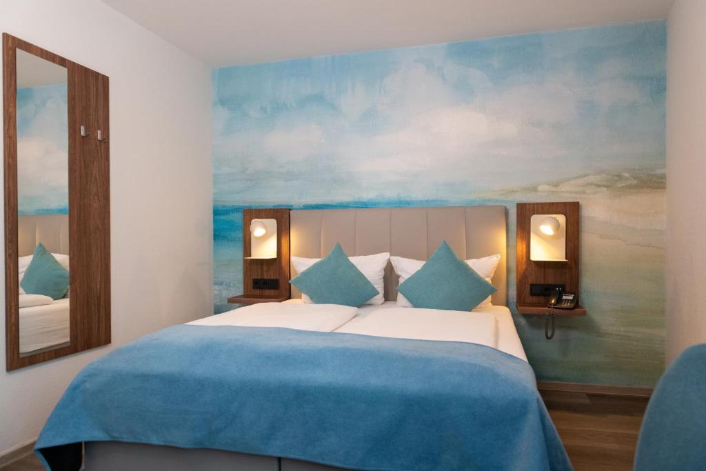 Postel nebo postele na pokoji v ubytování Art Hotel Aachen