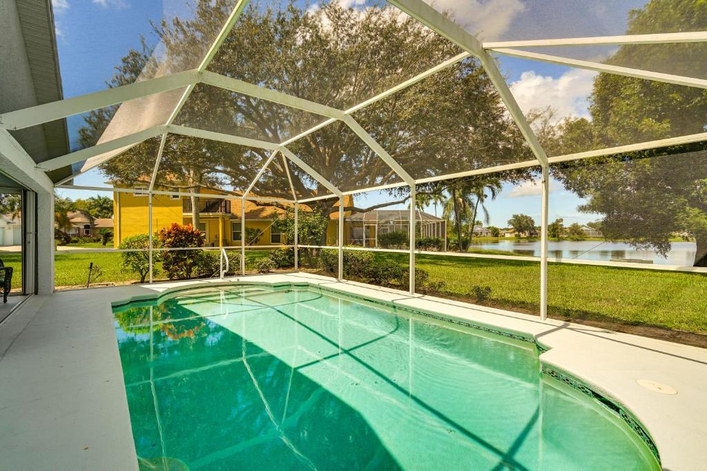 an indoor swimming pool with a glass roof at 4 Mi to Beach Beach Haven with Water Views! in Fort Myers