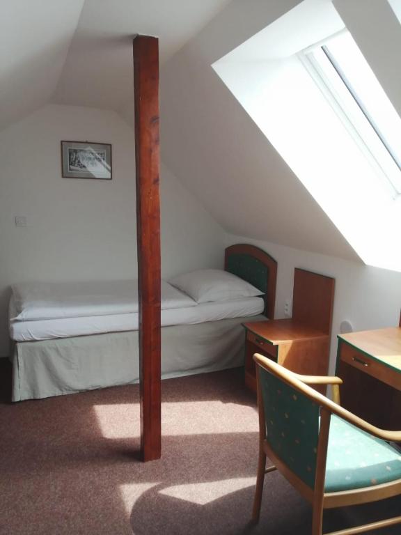 Postel nebo postele na pokoji v ubytování Apartman Reduta