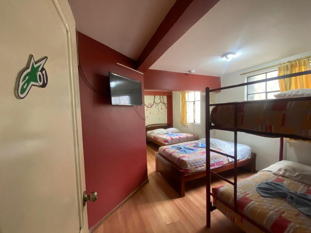 Postel nebo postele na pokoji v ubytování Andes Hostal