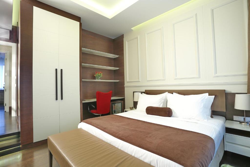 Postel nebo postele na pokoji v ubytování Belgreat Premium Suites