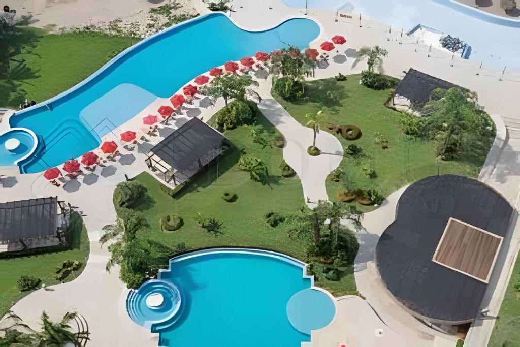 an overhead view of a pool at a resort at Exquisite Oceanfront Condo outstanding experience! in Puerto Vallarta