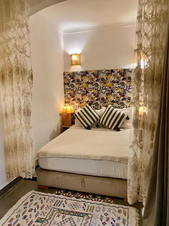 Postel nebo postele na pokoji v ubytování Riad Green Vines