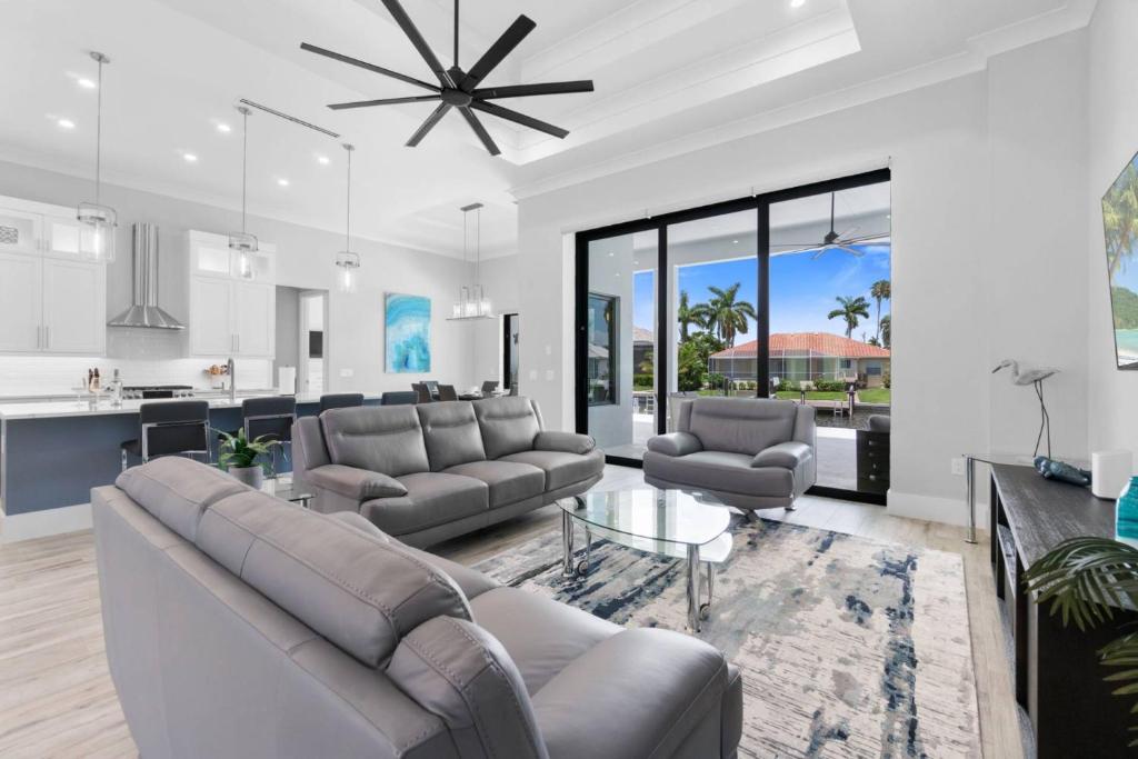 a living room with a couch and a table at Gulf Breezes in Marco Island