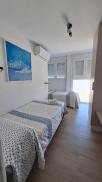 Postel nebo postele na pokoji v ubytování TU DENSCANSO EN VALDELAGRANA FRENTE AL MAR