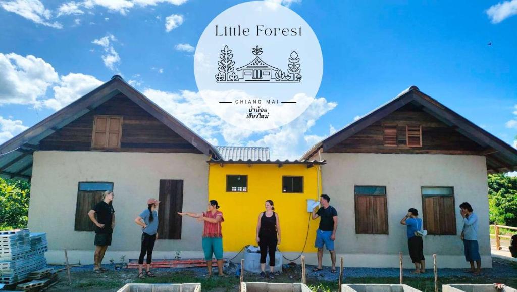 a group of people standing in front of a house at Little Forest Chiang Mai in Chiang Mai