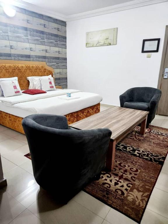 Postel nebo postele na pokoji v ubytování Ne-yo hotel & rv lodges