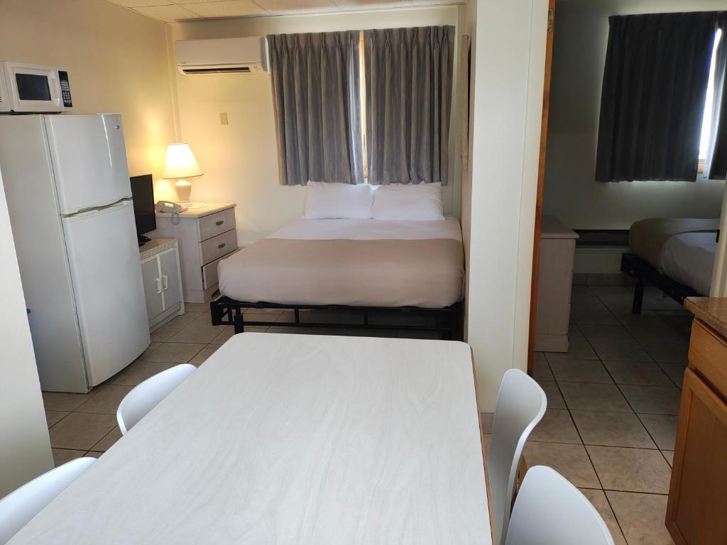 Postel nebo postele na pokoji v ubytování Condor Motel - Beach Block