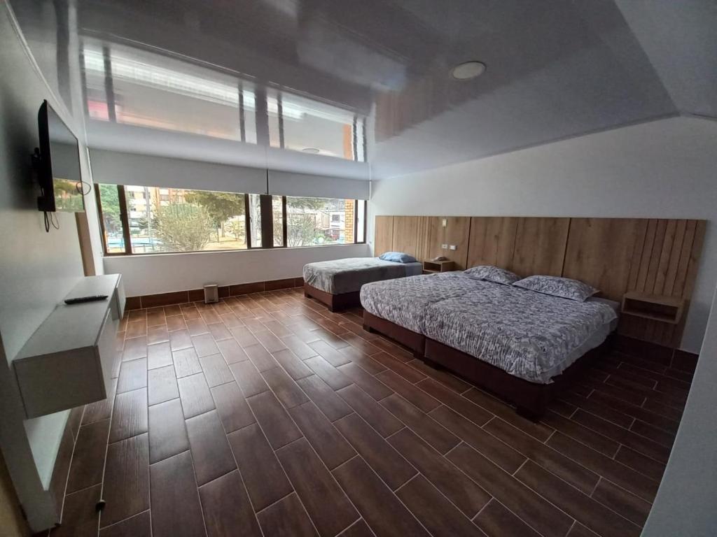 Postel nebo postele na pokoji v ubytování Aw Hotel Ariston Embassy