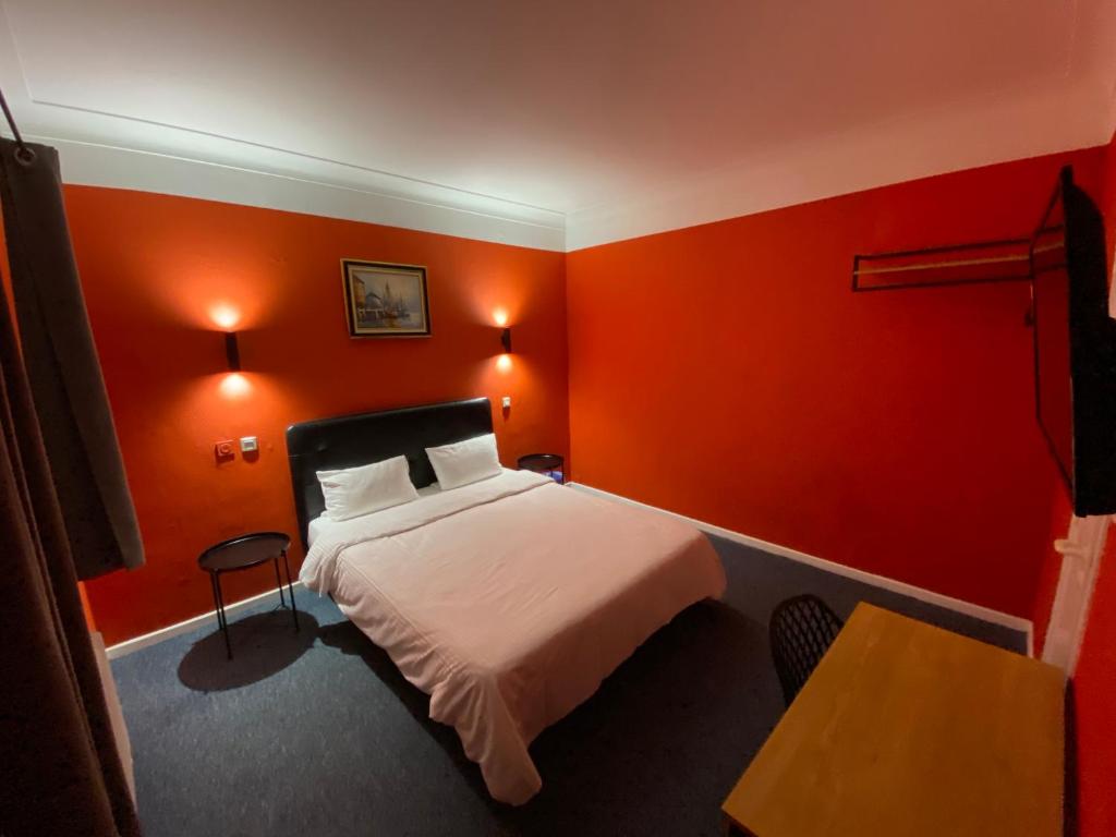 Postel nebo postele na pokoji v ubytování Hotel Windsor