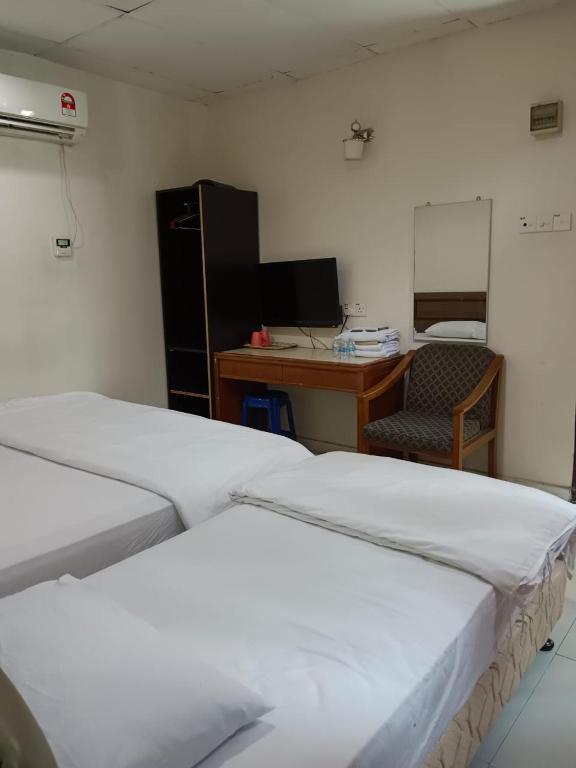 Postel nebo postele na pokoji v ubytování Hotel Kavanass Inn